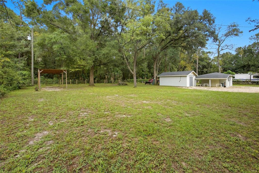 3157 Highway 41 Dunnellon, FL 34432 - Photo 7 of 38 a view of a house with a backyard