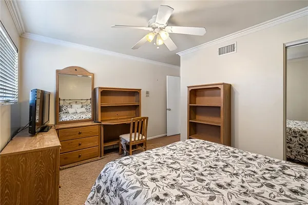 a bedroom with a bed and furniture