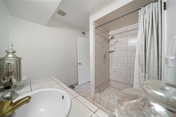 a bathroom with a sink and a shower