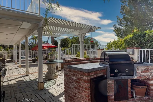 a view of a patio with table and chairs