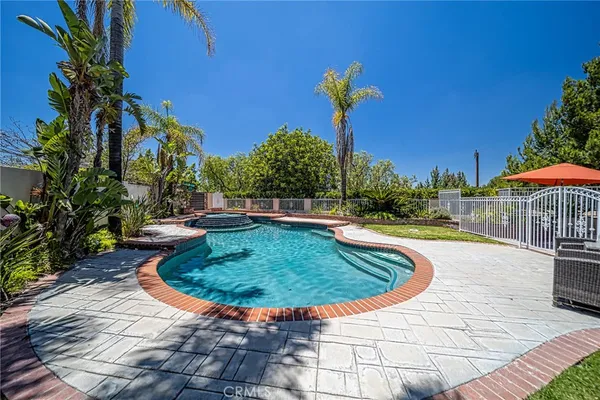 a view of a swimming pool with a patio
