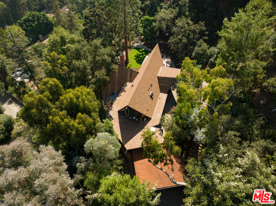 1963 Mandeville Canyon Road Los Angeles, CA 90049 - Photo 43 of 46 an aerial view of a house with a yard and garden