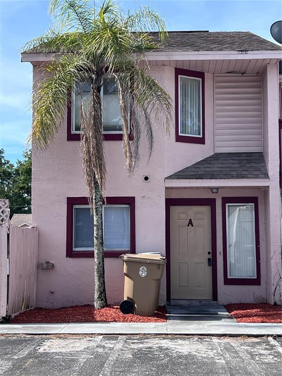 131 Jones Lane, Unit A Kissimmee, FL 34743 - Photo 1 of 23 a view of a house with a door and balcony