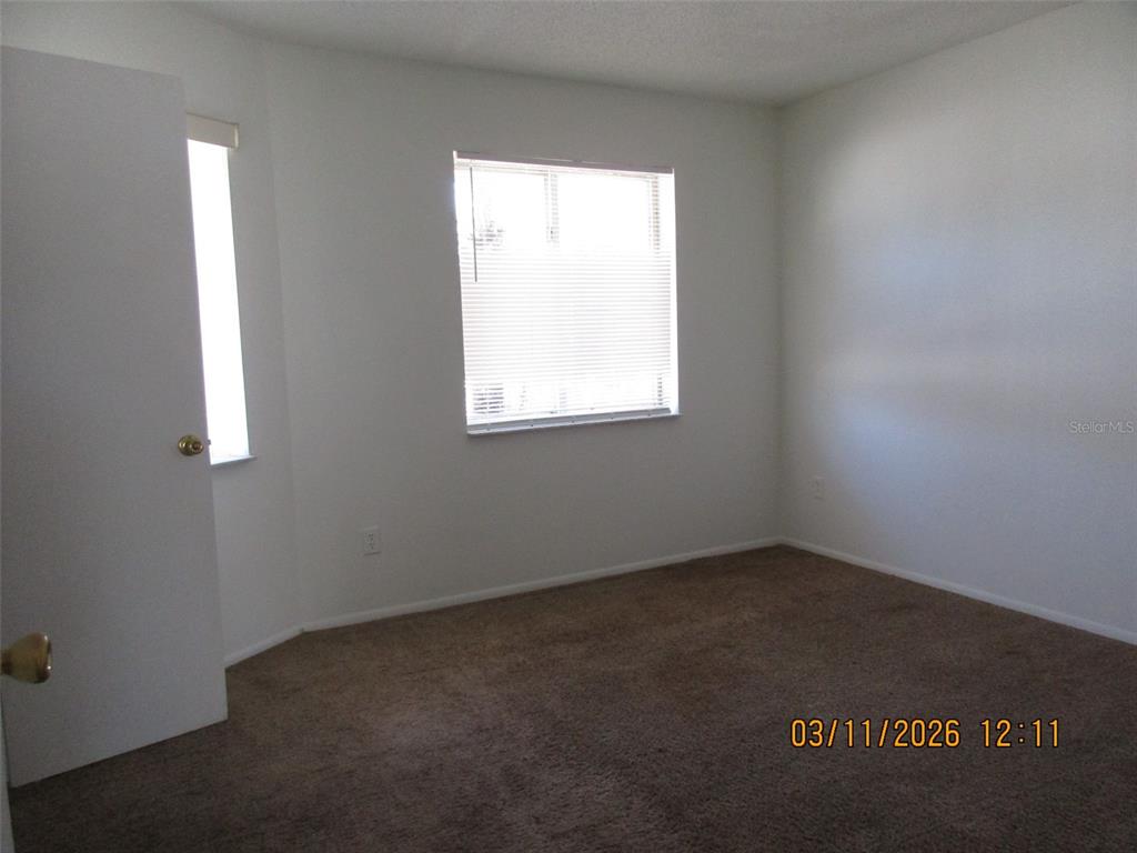 131 Jones Lane, Unit A Kissimmee, FL 34743 - Photo 20 of 23 an empty room with a window