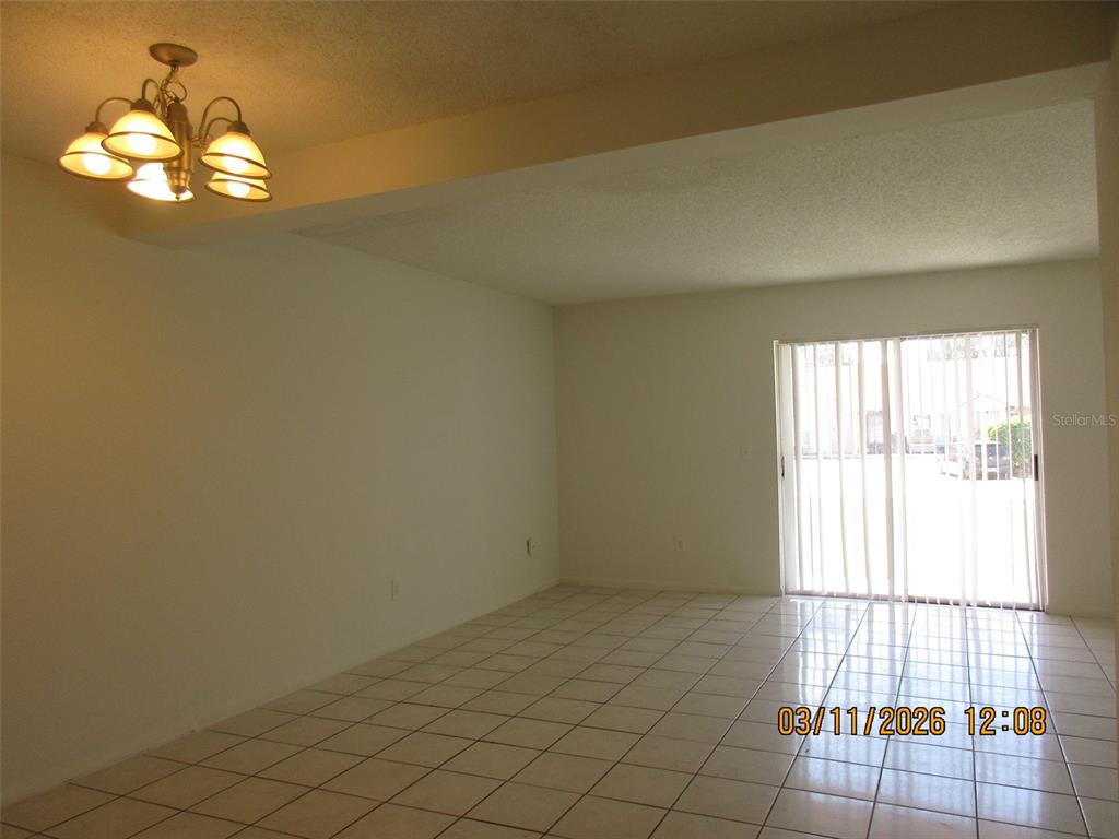 131 Jones Lane, Unit A Kissimmee, FL 34743 - Photo 2 of 23 en empty room with windows
