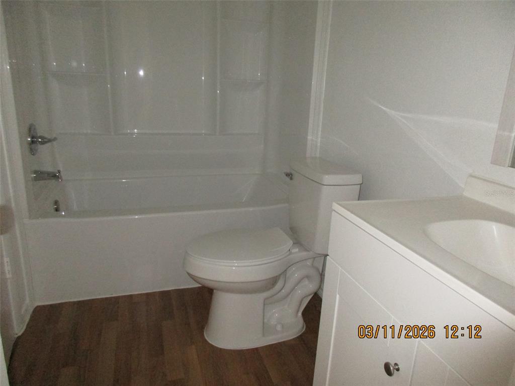 131 Jones Lane, Unit A Kissimmee, FL 34743 - Photo 23 of 23 a bathroom with a sink a toilet and shower