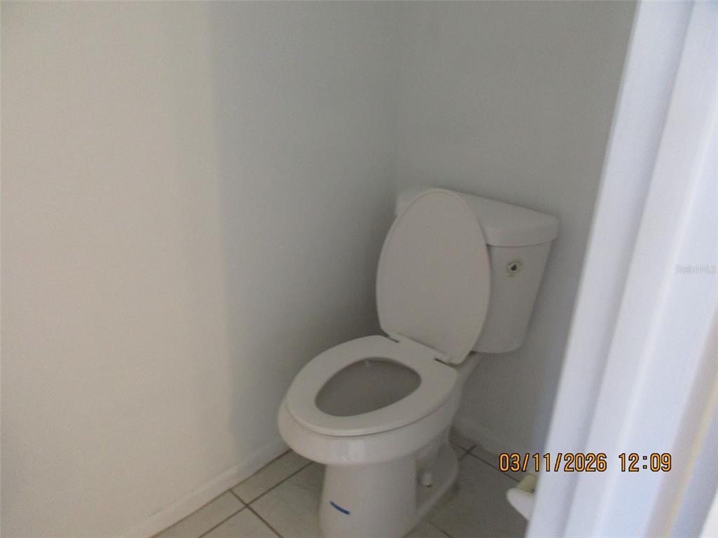 131 Jones Lane, Unit A Kissimmee, FL 34743 - Photo 6 of 23 a close view of a toilet in a bathroom