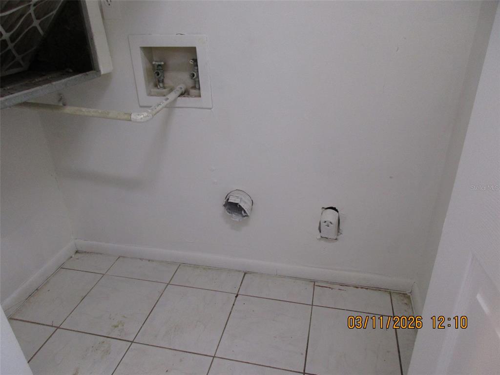 131 Jones Lane, Unit A Kissimmee, FL 34743 - Photo 10 of 23 a view of a room with shelf