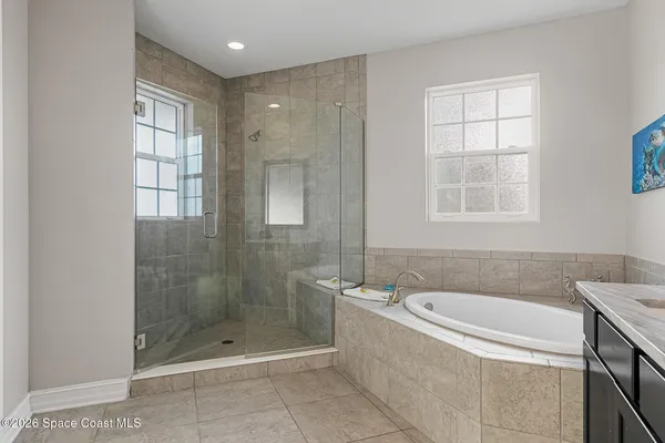 a bathroom with a bathtub and shower