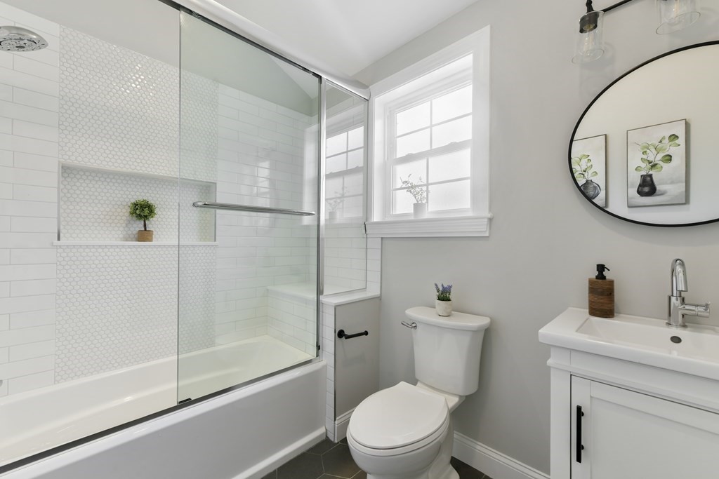 25 Locust Street, Unit 2 Winthrop, MA 02152 - Photo 16 of 29 a bathroom with a toilet a sink and a shower
