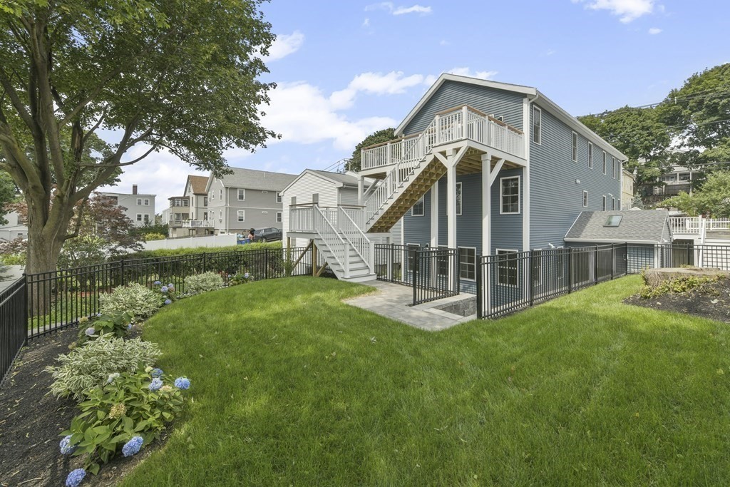 25 Locust Street, Unit 2 Winthrop, MA 02152 - Photo 22 of 29 a front view of a house with a yard