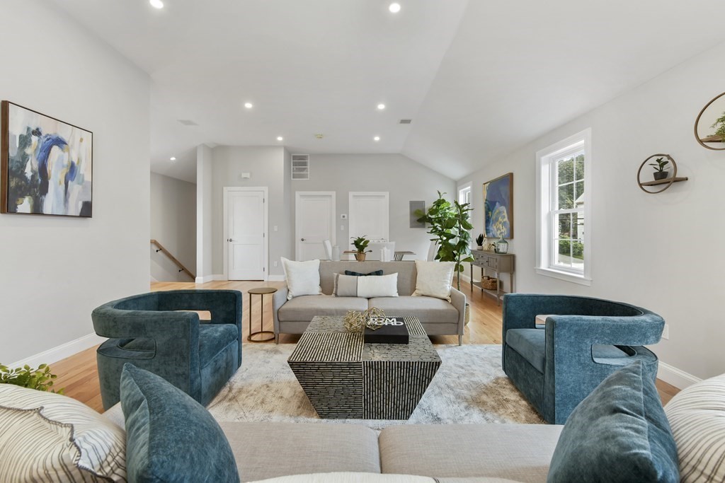 25 Locust Street, Unit 2 Winthrop, MA 02152 - Photo 3 of 29 a living room with furniture potted plant and a window
