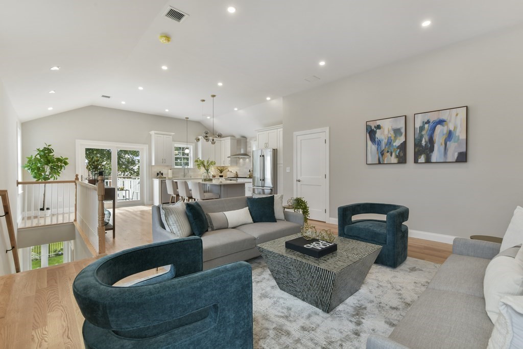 25 Locust Street, Unit 2 Winthrop, MA 02152 - Photo 6 of 29 a living room with furniture and a large window