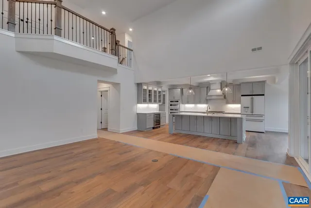 a view of a kitchen with a sink and cabinets