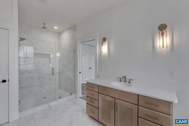 a bathroom with a sink double vanity and shower