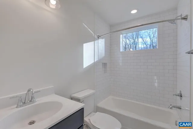 a bathroom with a sink toilet and bathtub