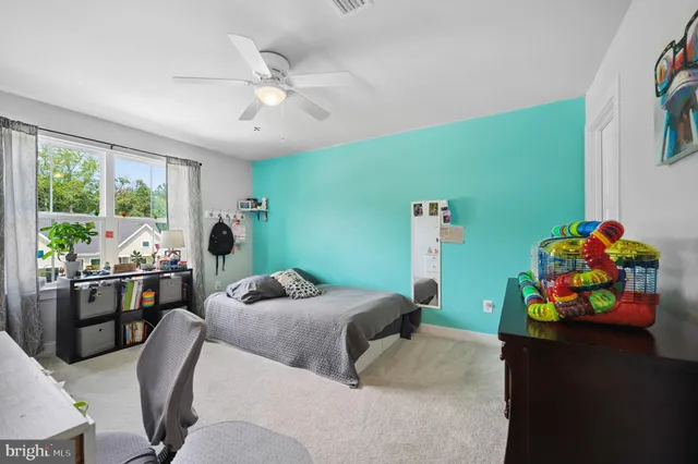 a bedroom with furniture and a window