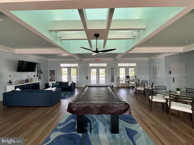 a view of a livingroom with furniture window and wooden floor