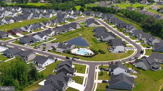 an aerial view of a residential building with outdoor space