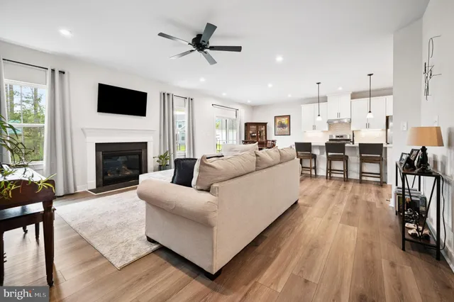 a living room with furniture fireplace and flat screen tv