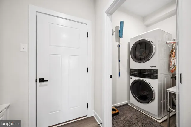 a view of a hallway with washer and dryer