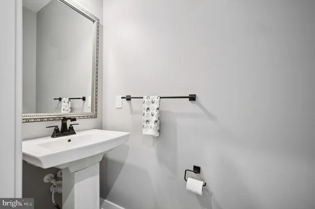 a bathroom with a sink and mirror