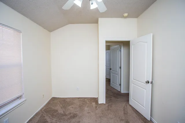 an empty room with a bathroom