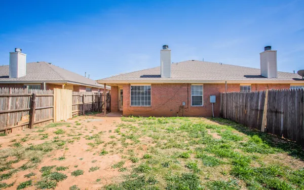 a view of front door and small yard