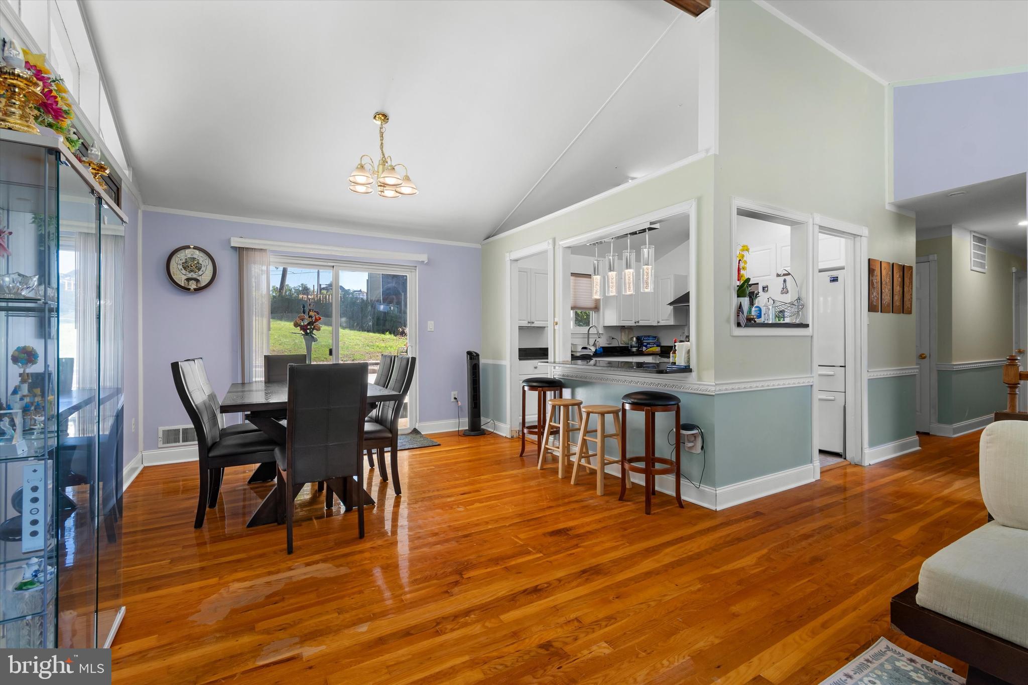 8304 Harland Drive Springfield, VA 22152 - Photo 13 of 39 a view of a dining room with furniture and wooden floor