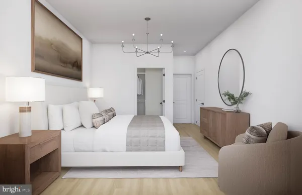 a bedroom with a bed a mirror on dresser and a window