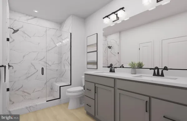 a bathroom with a granite countertop toilet a sink and a mirror