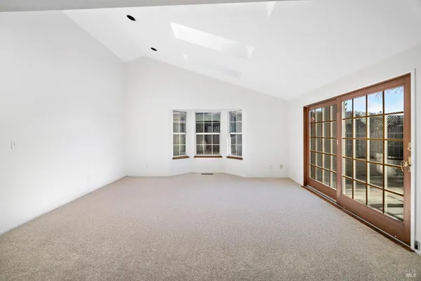 a view of a room with a large window