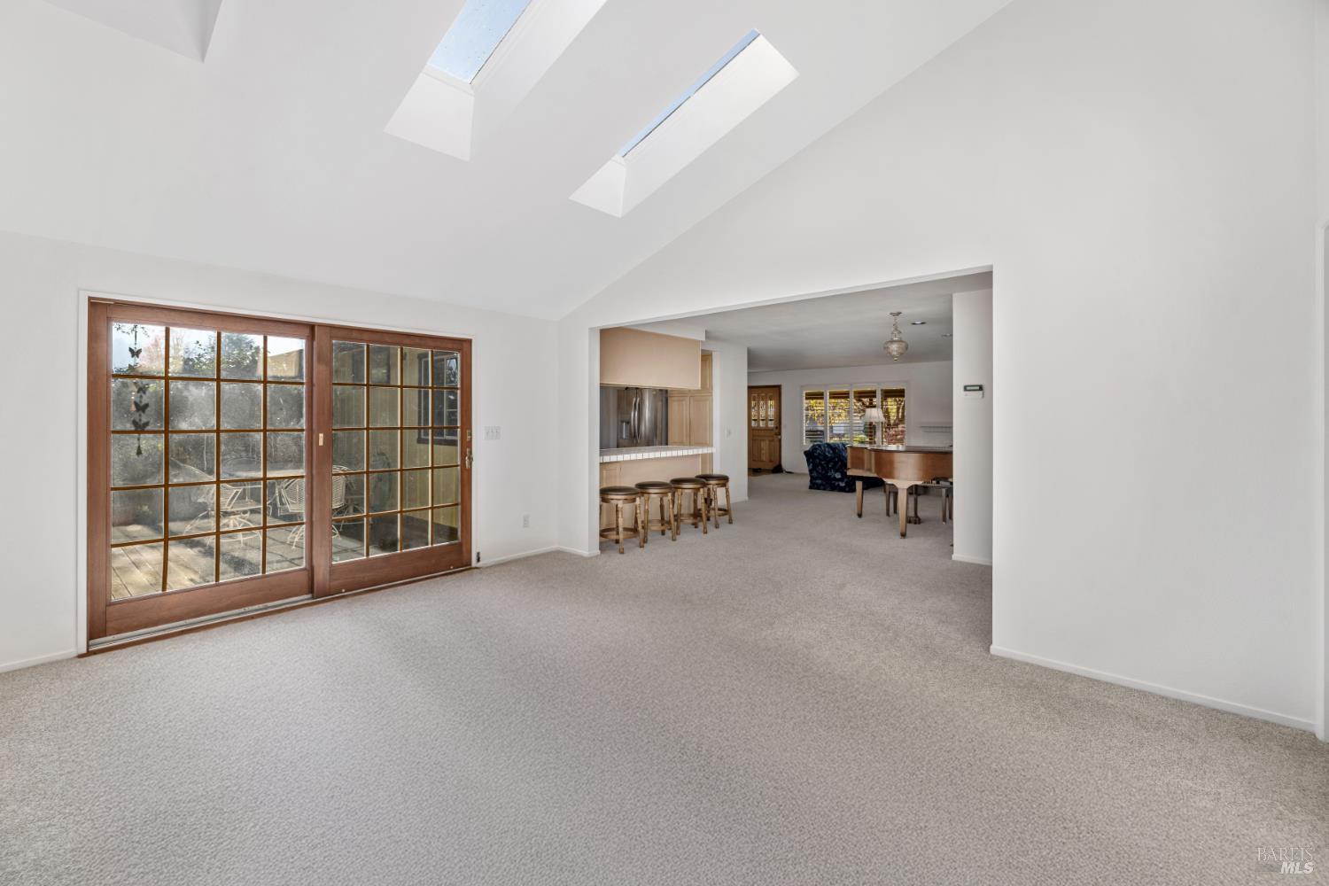 6 Oakhurst Place Santa Rosa, CA 95409 - Photo 12 of 42 an empty room with furniture and large windows