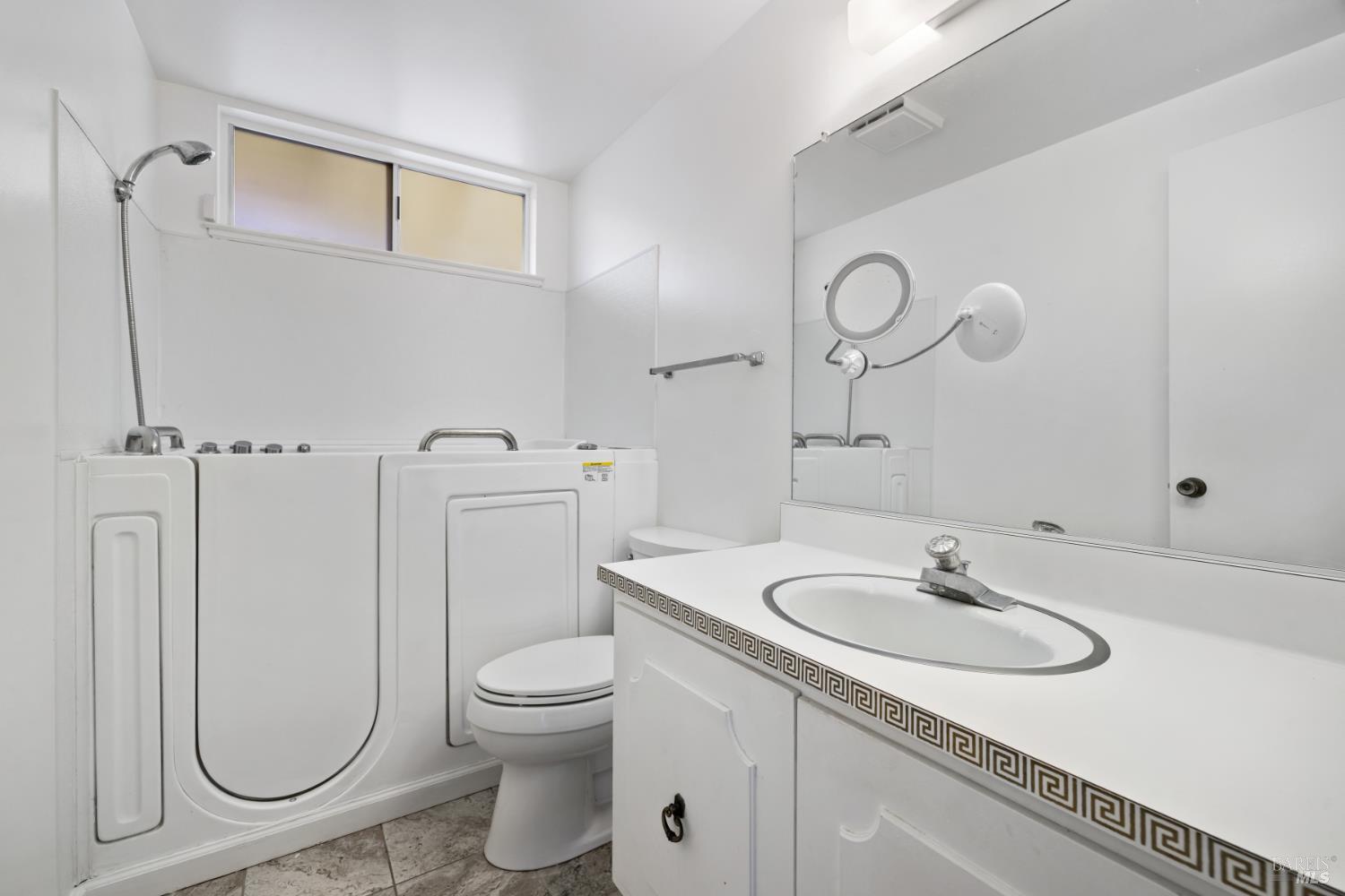 6 Oakhurst Place Santa Rosa, CA 95409 - Photo 20 of 42 a bathroom with a sink a toilet and a mirror