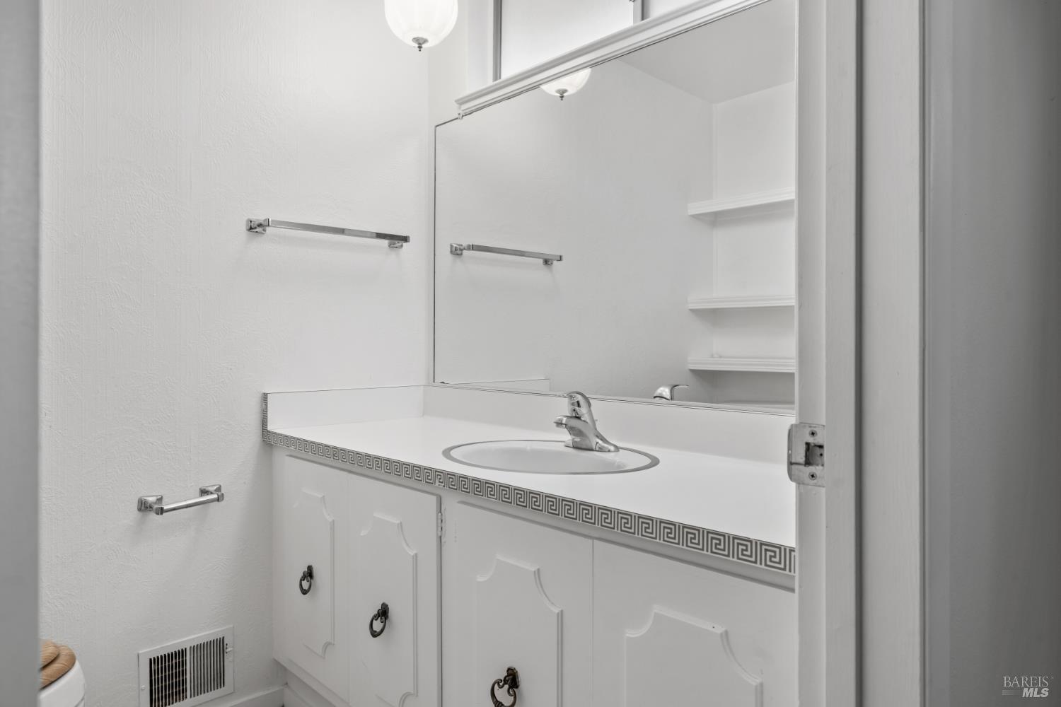 6 Oakhurst Place Santa Rosa, CA 95409 - Photo 23 of 42 a bathroom with a sink and a mirror