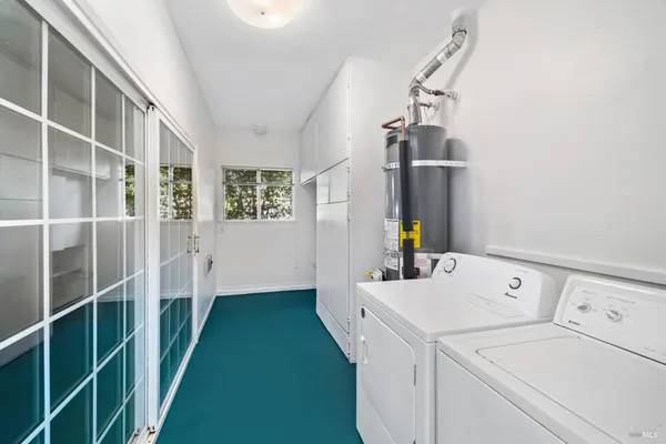 a view of storage and utility room with washer and dryer