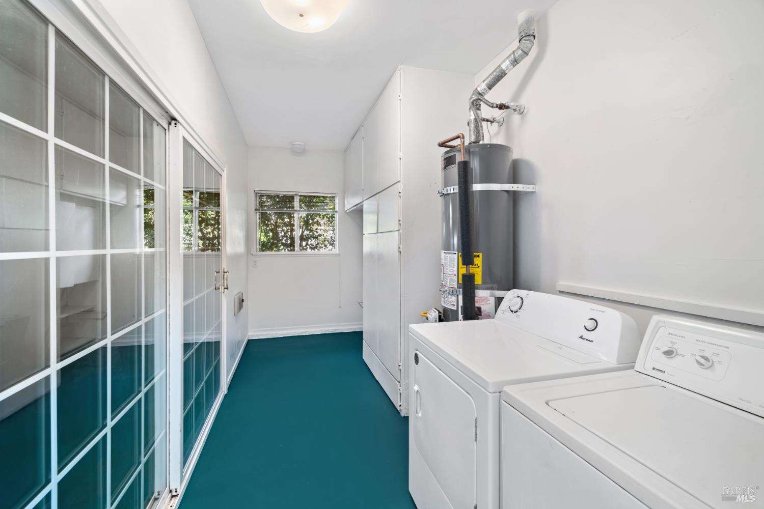 6 Oakhurst Place Santa Rosa, CA 95409 - Photo 28 of 42 a view of storage and utility room with washer and dryer