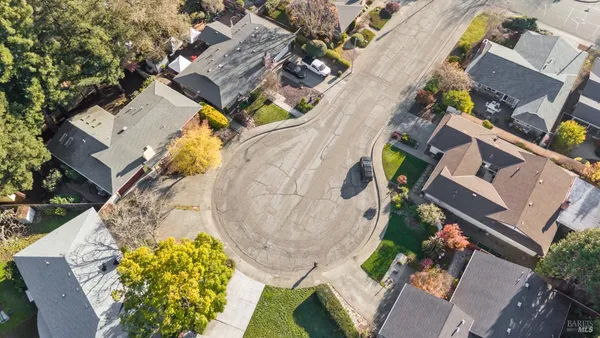an aerial view of a house with a swimming pool