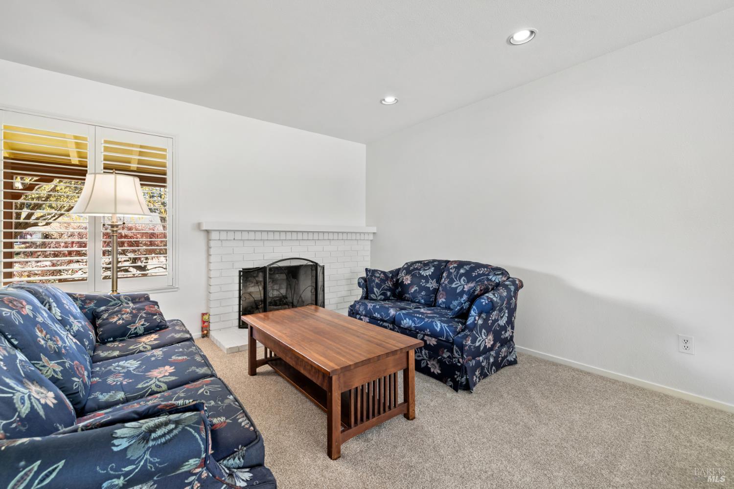 6 Oakhurst Place Santa Rosa, CA 95409 - Photo 6 of 42 a living room with furniture and a fireplace