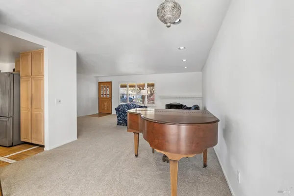 a room with a table and chairs
