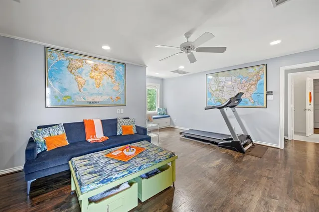 a building outdoor space with patio furniture and potted plants