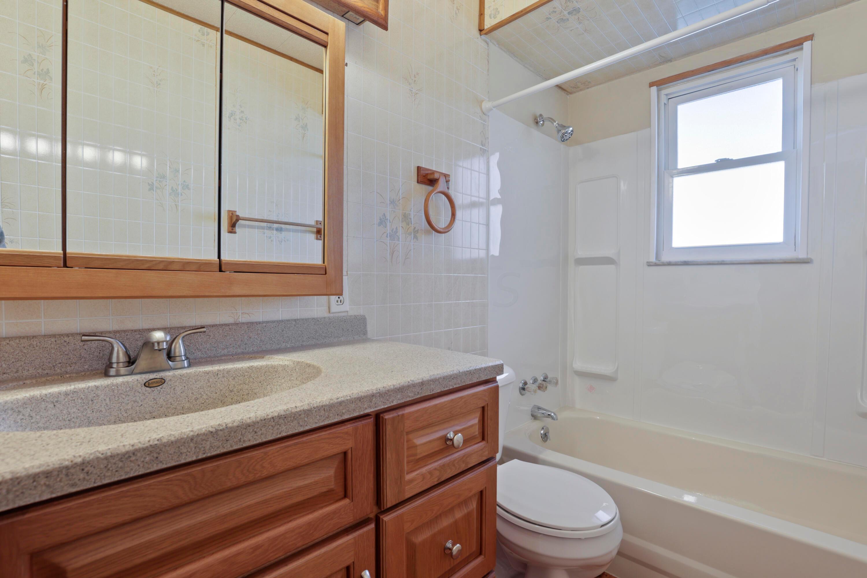 1137 Brown Road Columbus, OH 43223 - Photo 22 of 59 New sink, tub, toilet, and medicine cabinet.