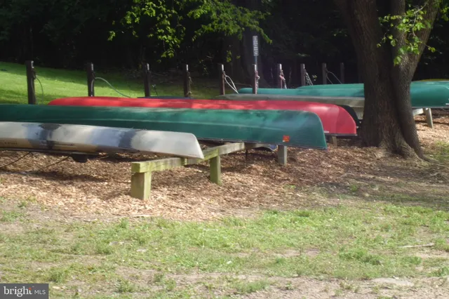 a backyard of a house with trampoline