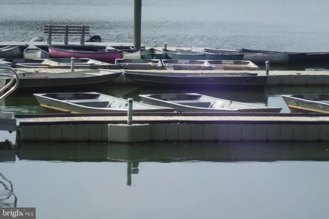 a kitchen with granite countertop cabinets and wooden floor