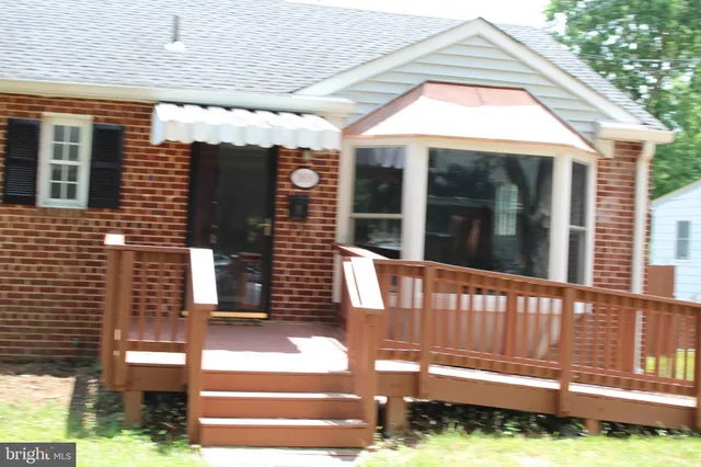 a kitchen with granite countertop a stove and a wooden cabinets