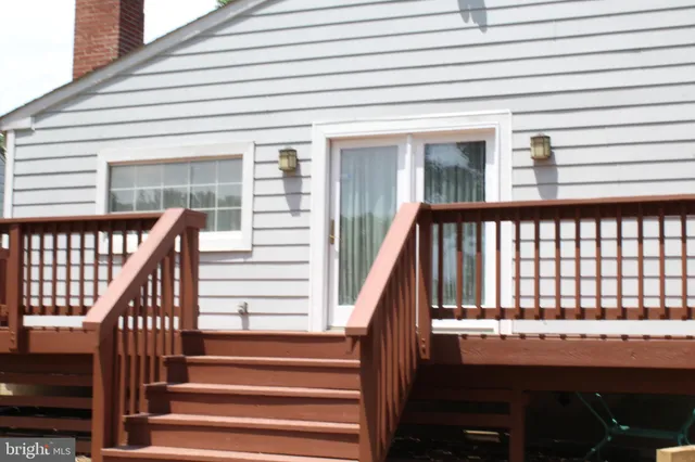 a kitchen with granite countertop a stove and a microwave