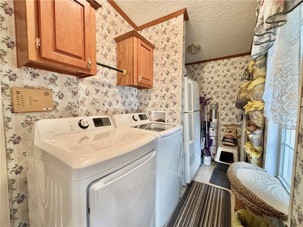 354 Harper Road Pendleton, SC 29670 - Photo 13 of 30 This functional laundry area features modern appliances and convenient overhead storage.