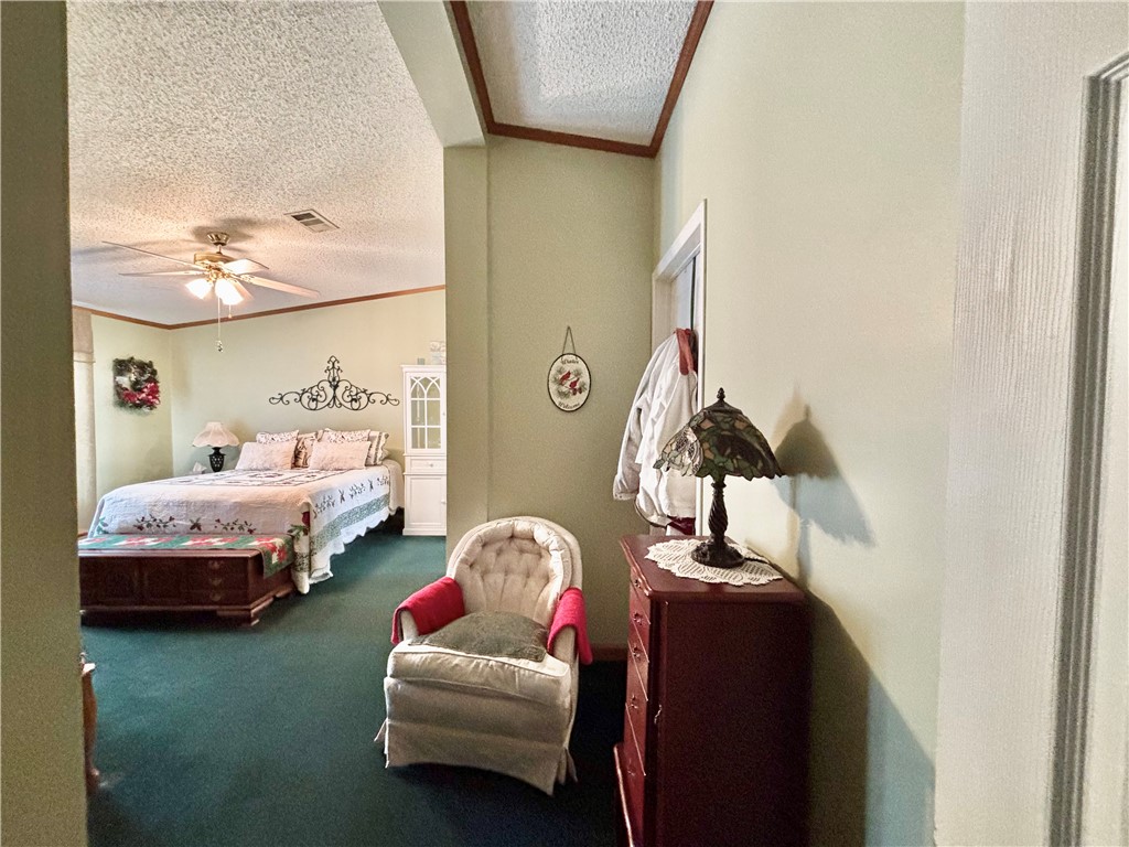 354 Harper Road Pendleton, SC 29670 - Photo 19 of 30 This spacious bedroom offers a tranquil retreat with soft lighting and ample room for relaxation.
