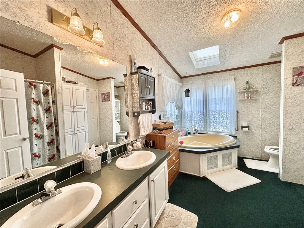 354 Harper Road Pendleton, SC 29670 - Photo 22 of 30 This spacious bathroom offers dual vanities and a soaking tub for ultimate relaxation.