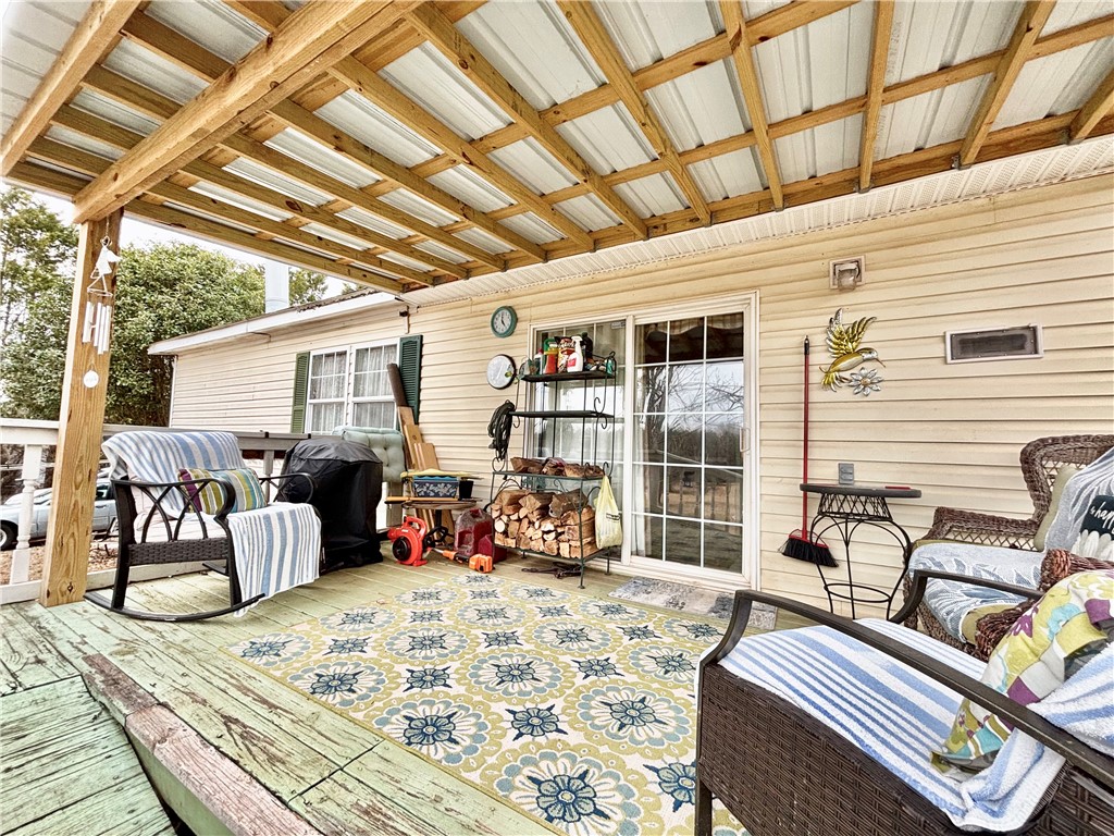 354 Harper Road Pendleton, SC 29670 - Photo 24 of 30 Enjoy outdoor living on this welcoming patio, perfect for relaxation and gatherings.